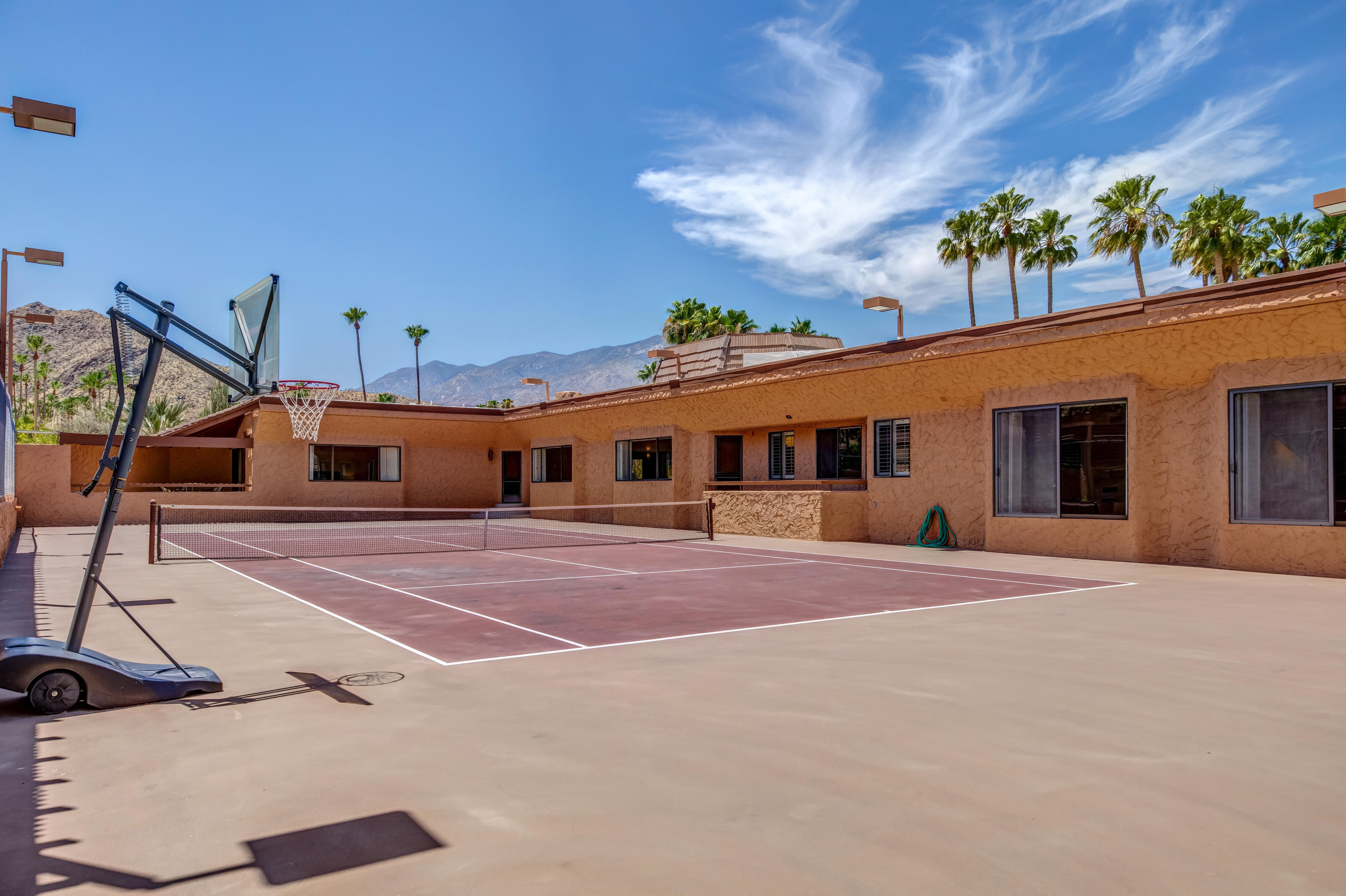 1650 Ridgemore Drive Palm Springs, CA 92264 - Photo 38 of 69 a front view of a house with a yard