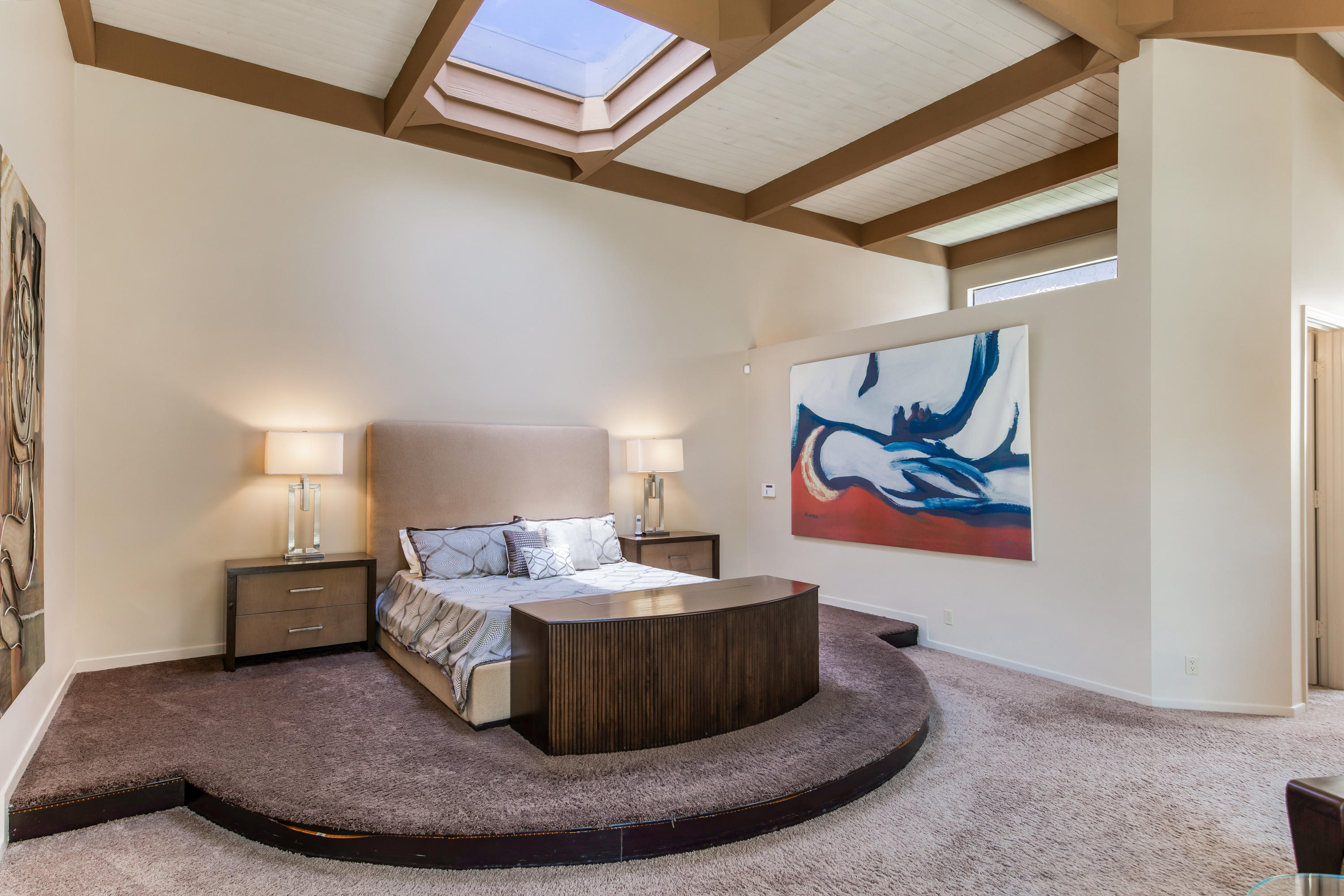 1650 Ridgemore Drive Palm Springs, CA 92264 - Photo 44 of 69 a living room with furniture and a painting on the wall