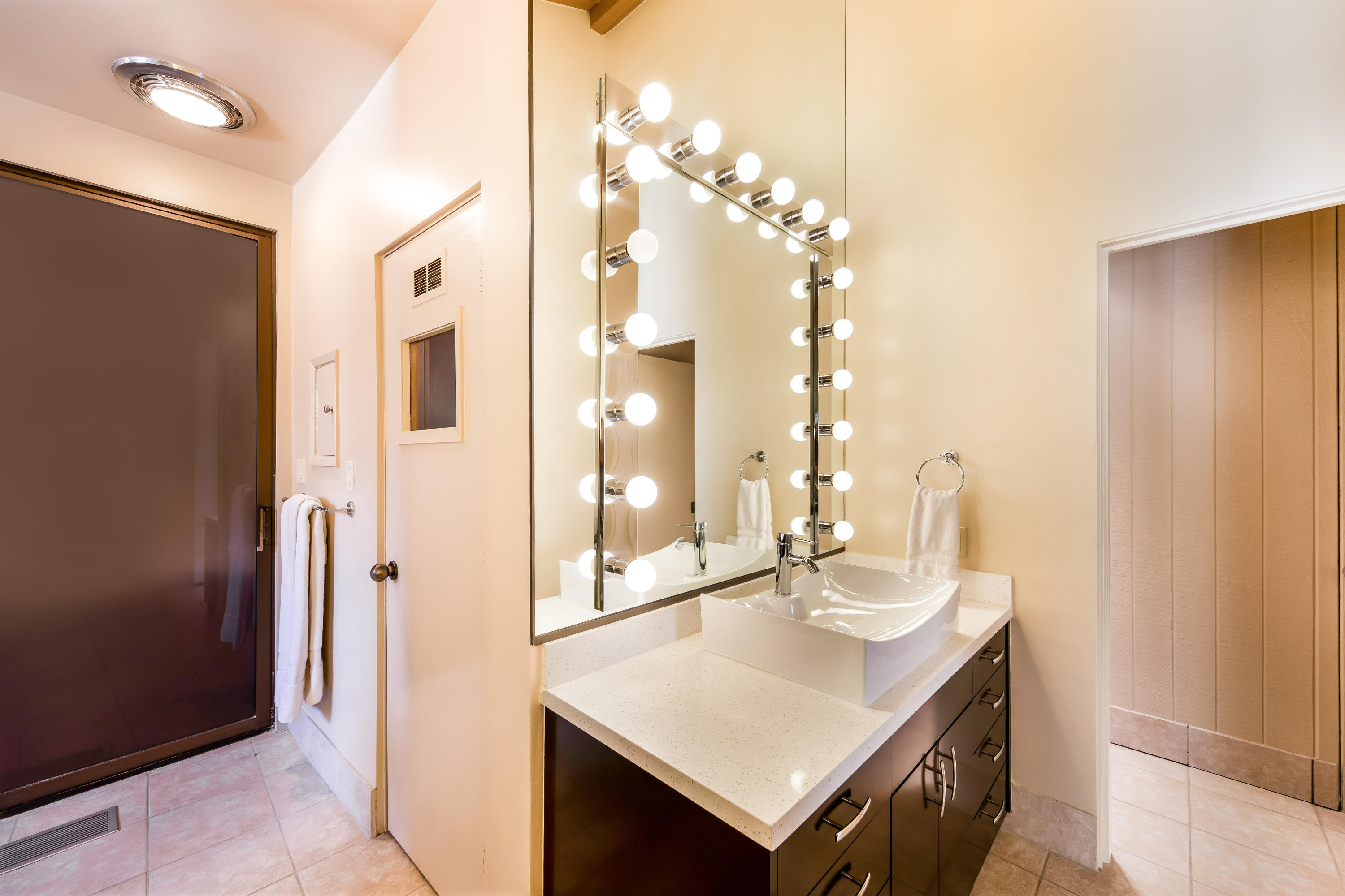 1650 Ridgemore Drive Palm Springs, CA 92264 - Photo 47 of 69 a bathroom with a sink a shower and a mirror