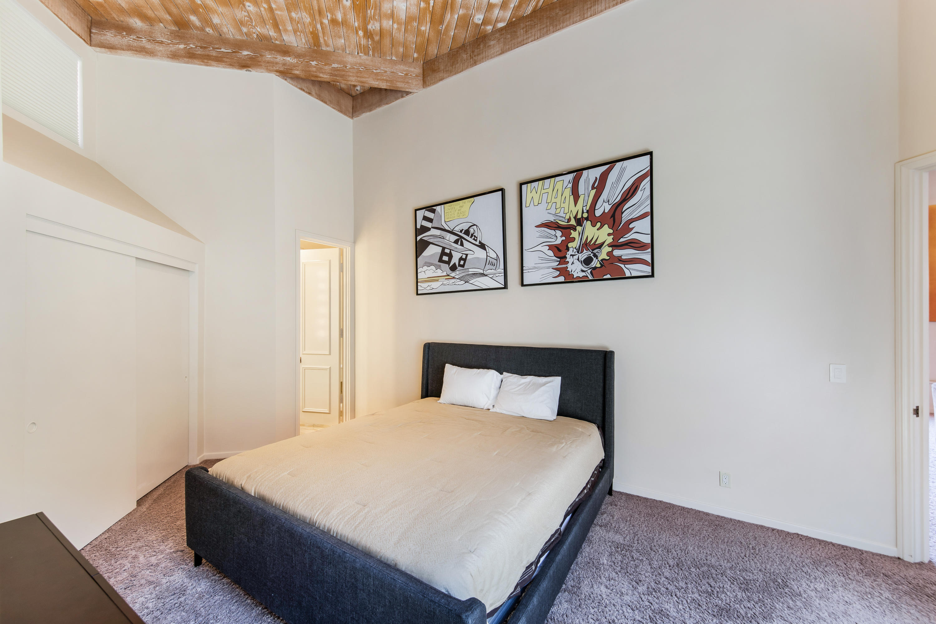 1650 Ridgemore Drive Palm Springs, CA 92264 - Photo 56 of 69 a bedroom with a bed and painting on the wall