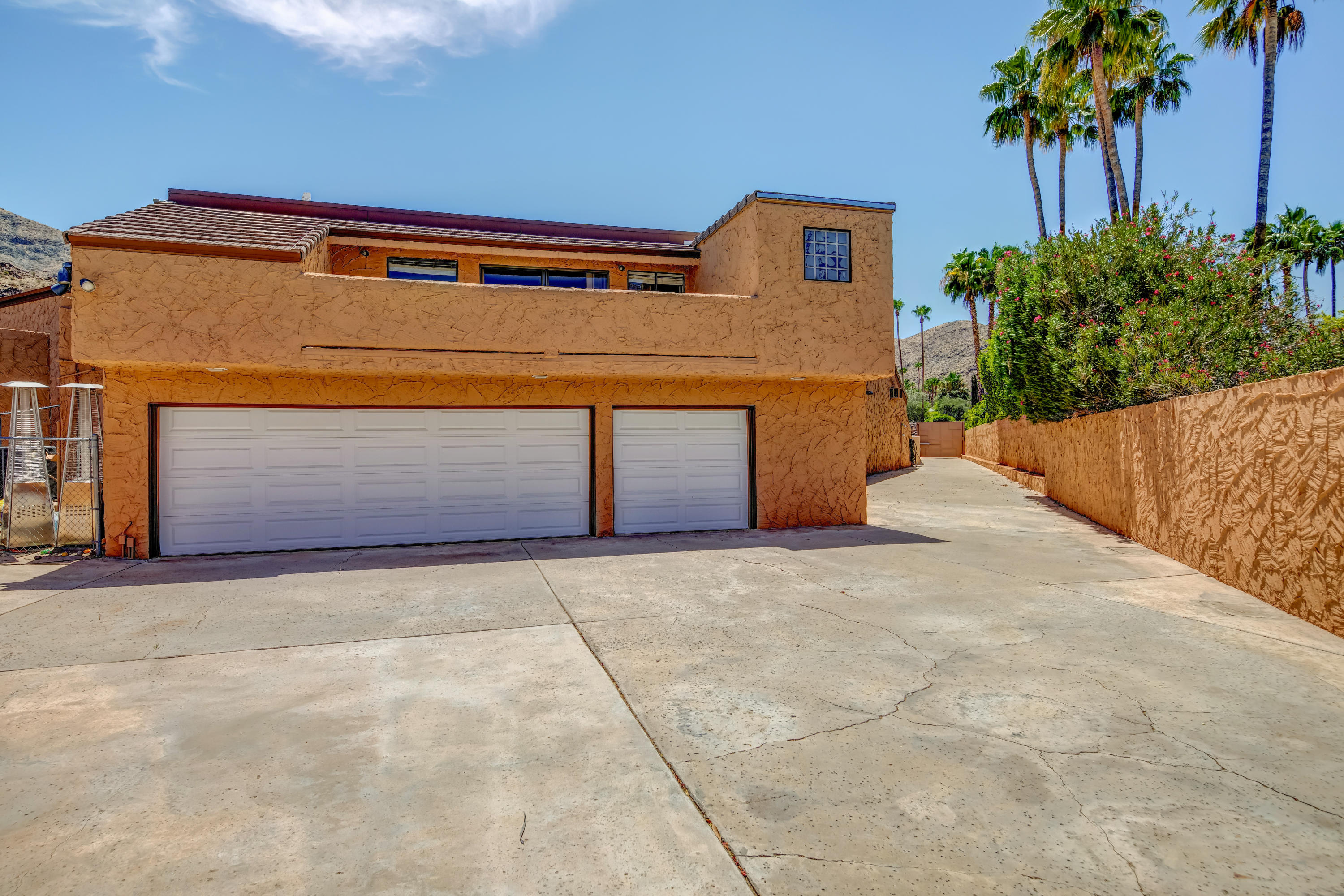 1650 Ridgemore Drive Palm Springs, CA 92264 - Photo 59 of 69 a front view of a house with plants
