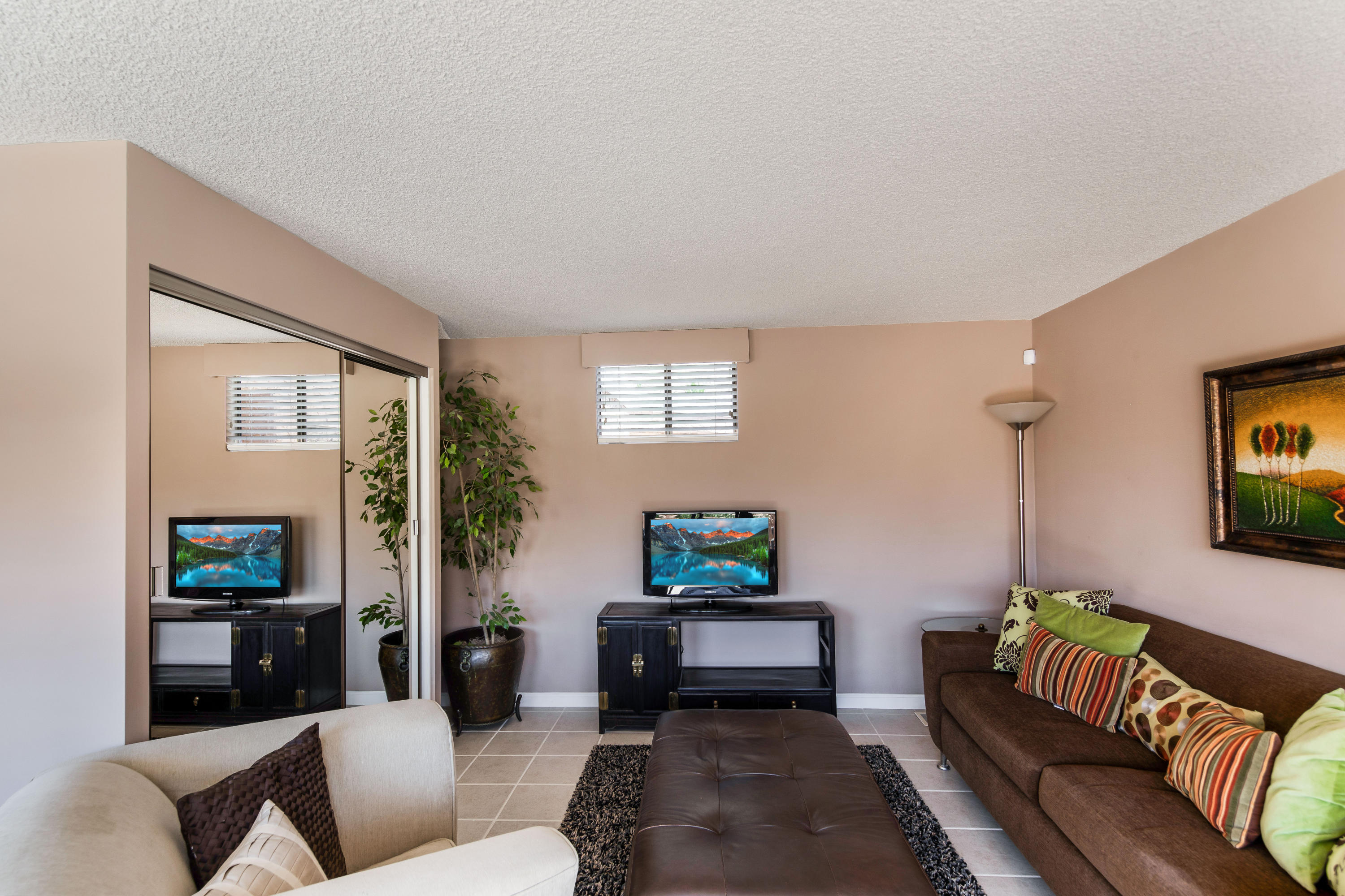 1650 Ridgemore Drive Palm Springs, CA 92264 - Photo 65 of 69 a living room with furniture and a potted plant