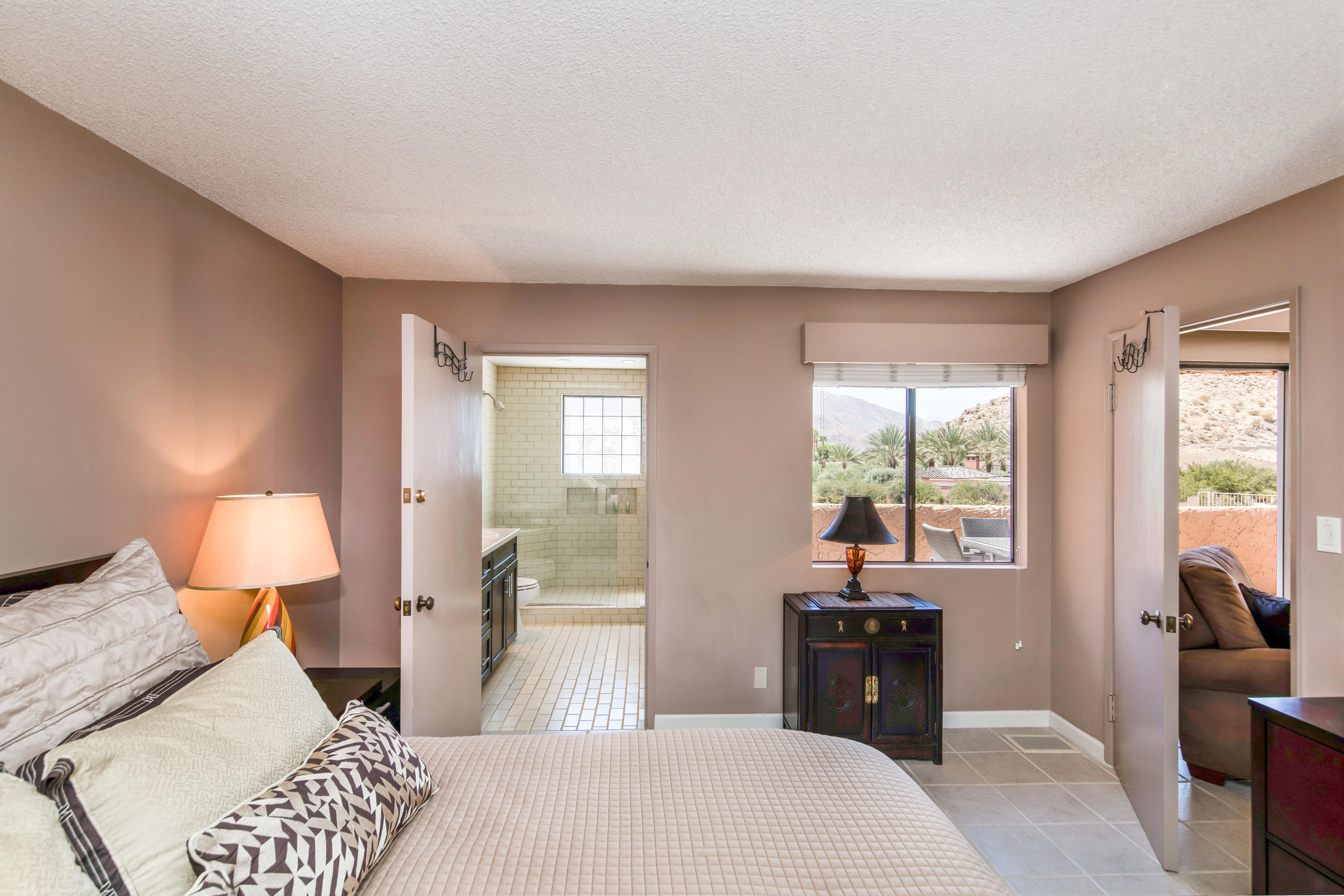 1650 Ridgemore Drive Palm Springs, CA 92264 - Photo 68 of 69 a bedroom with a bed and wooden floor