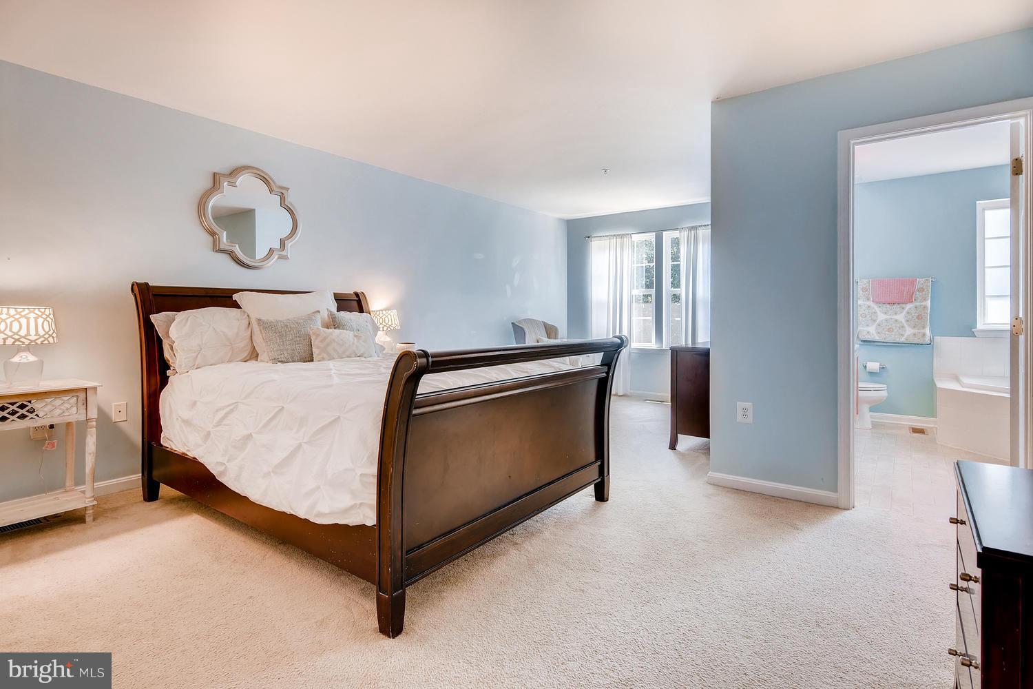 3089 Raking Leaf Drive Abingdon, MD 21009 - Photo 15 of 28 a bed room with a bed and a chandelier