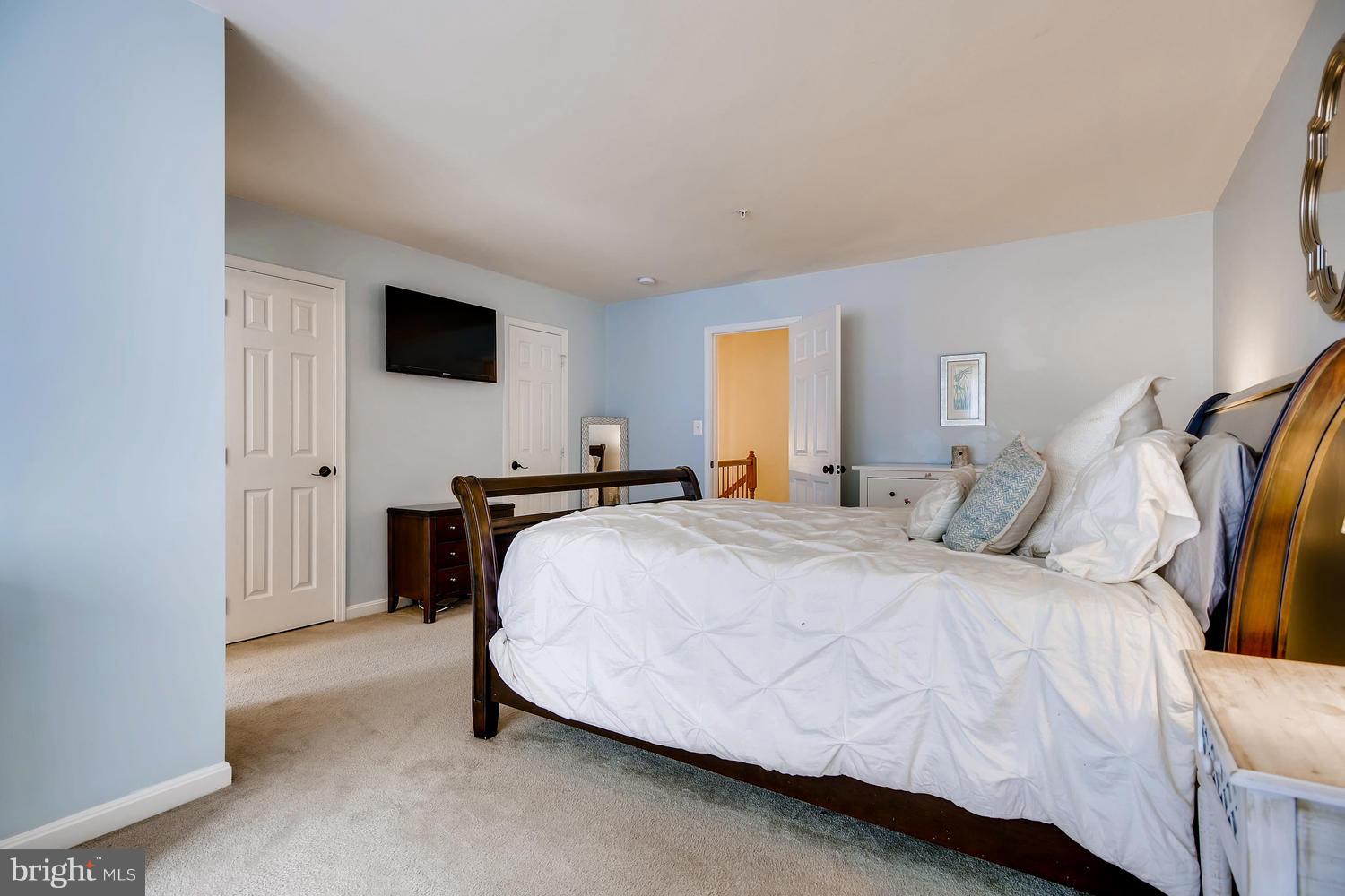 3089 Raking Leaf Drive Abingdon, MD 21009 - Photo 17 of 28 a spacious bedroom with a bed and a window