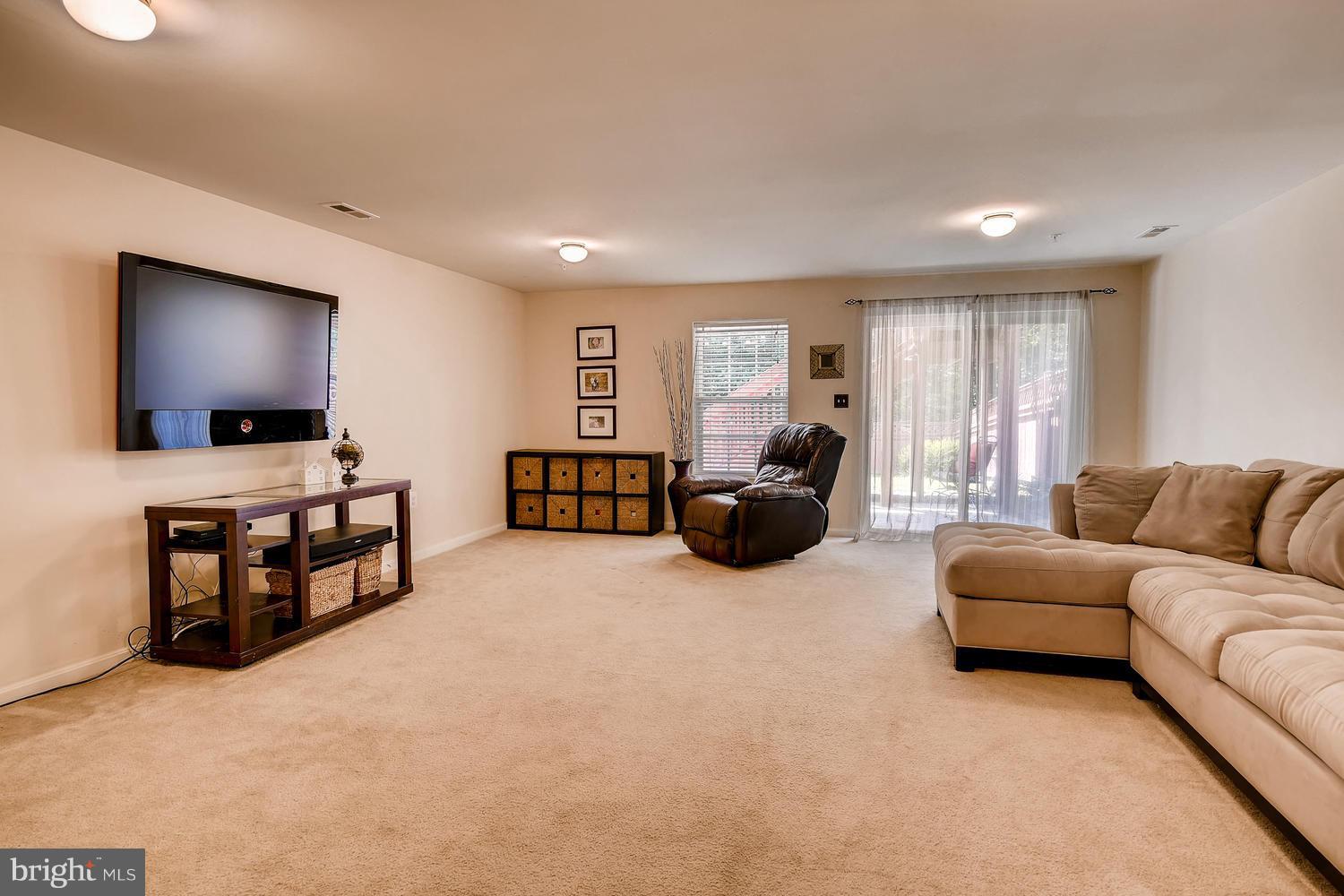 3089 Raking Leaf Drive Abingdon, MD 21009 - Photo 24 of 28 a living room with furniture and a flat screen tv