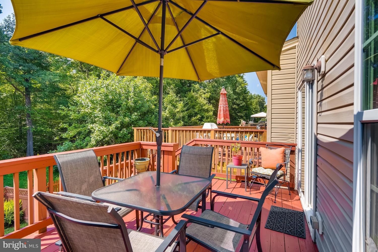 3089 Raking Leaf Drive Abingdon, MD 21009 - Photo 25 of 28 a view of balcony with furniture and umbrella
