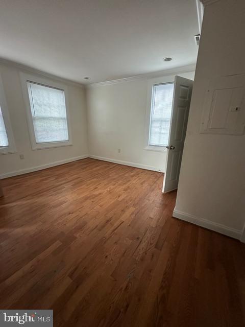 4005 4th Street Southeast, Unit 4 Washington, DC 20032 - Photo 5 of 10 an empty room with wooden floor and windows