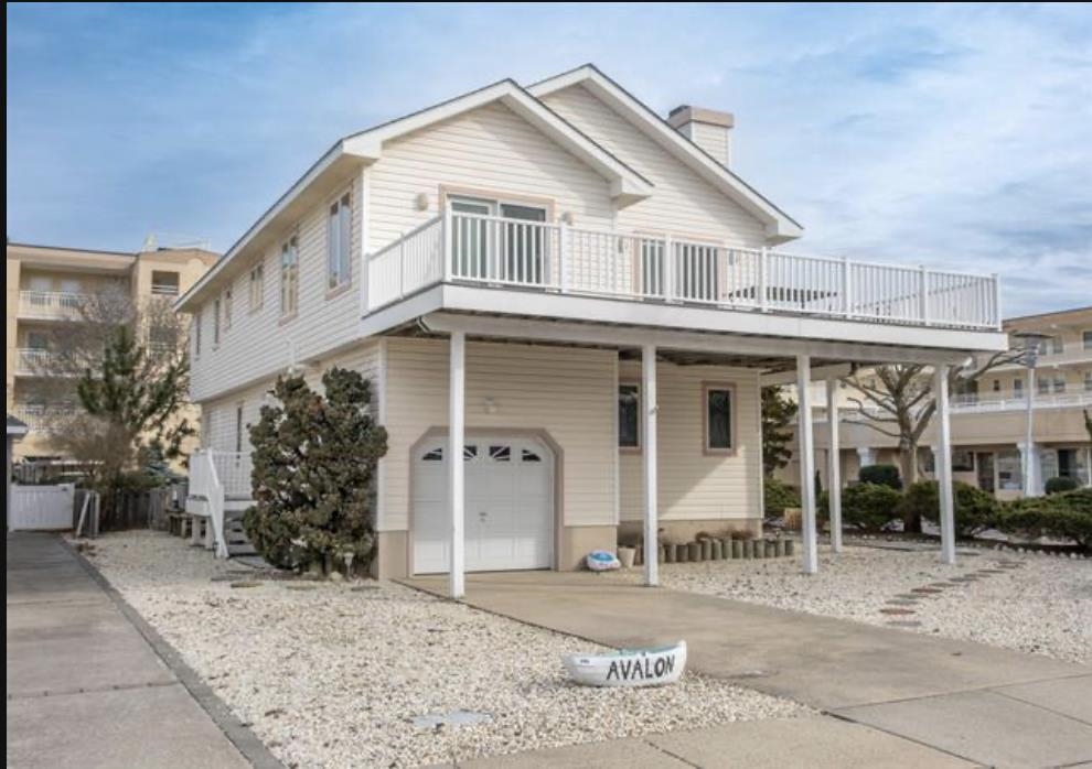 141 8th Street Avalon, NJ 08202 - Photo 1 of 21 a front view of a house with a yard