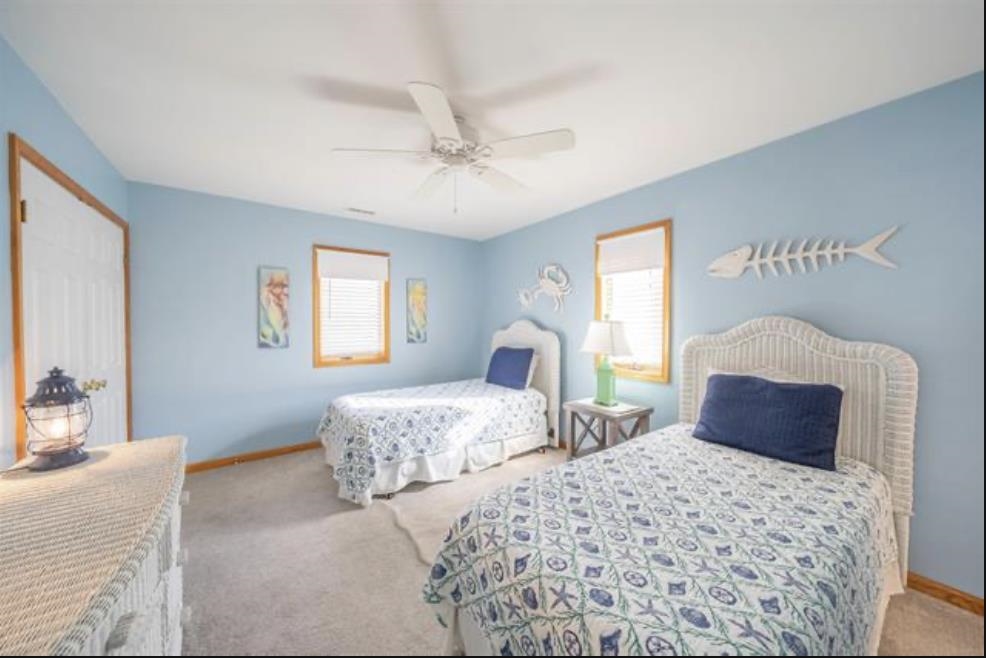 141 8th Street Avalon, NJ 08202 - Photo 12 of 21 a bedroom with two beds and a dresser
