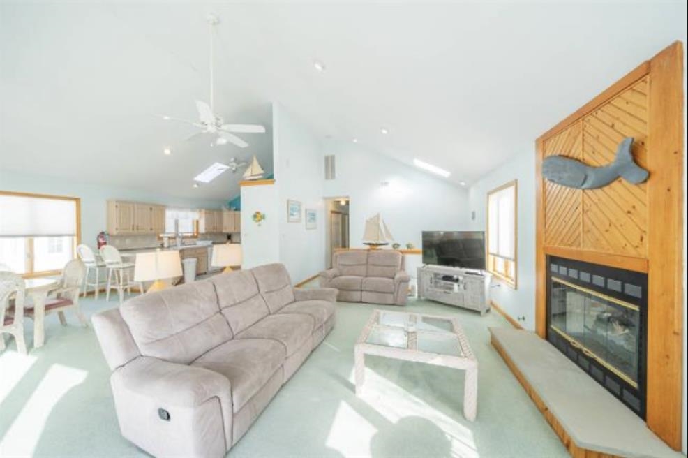 141 8th Street Avalon, NJ 08202 - Photo 17 of 21 a living room with furniture and a large window