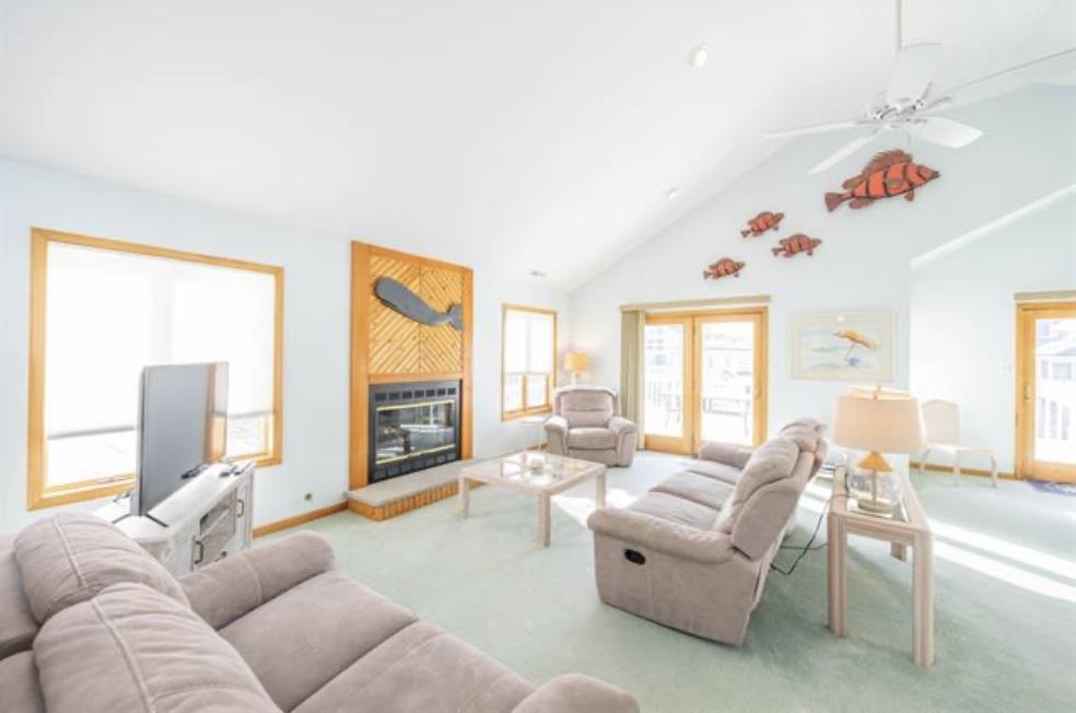 141 8th Street Avalon, NJ 08202 - Photo 20 of 21 a living room with furniture fireplace and a large window