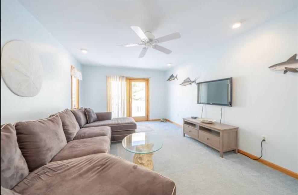 141 8th Street Avalon, NJ 08202 - Photo 6 of 21 a living room with furniture and a flat screen tv