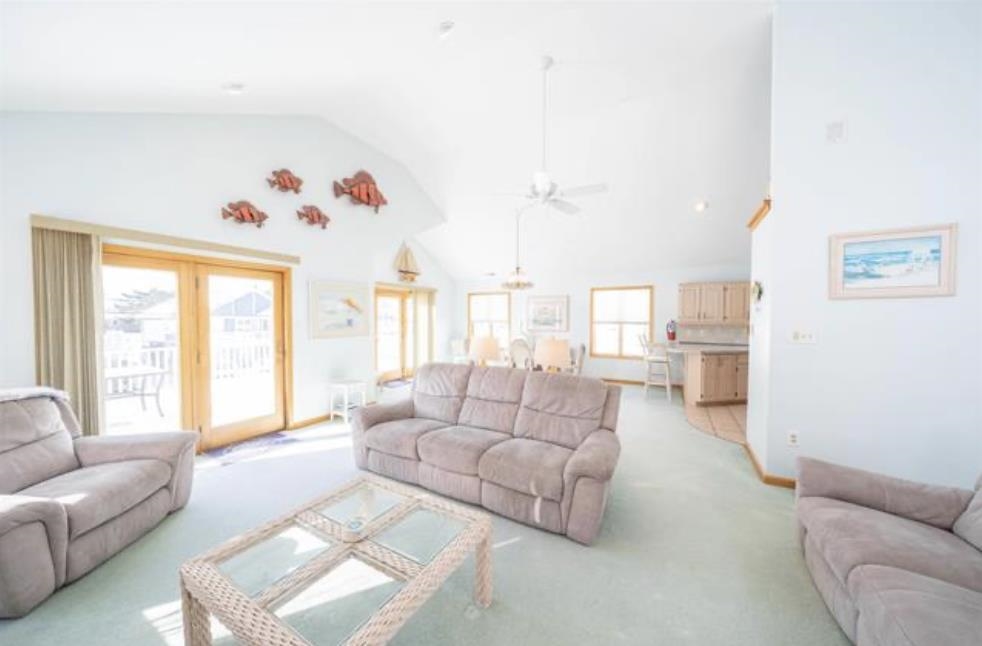 141 8th Street Avalon, NJ 08202 - Photo 8 of 21 a living room with furniture and a large window