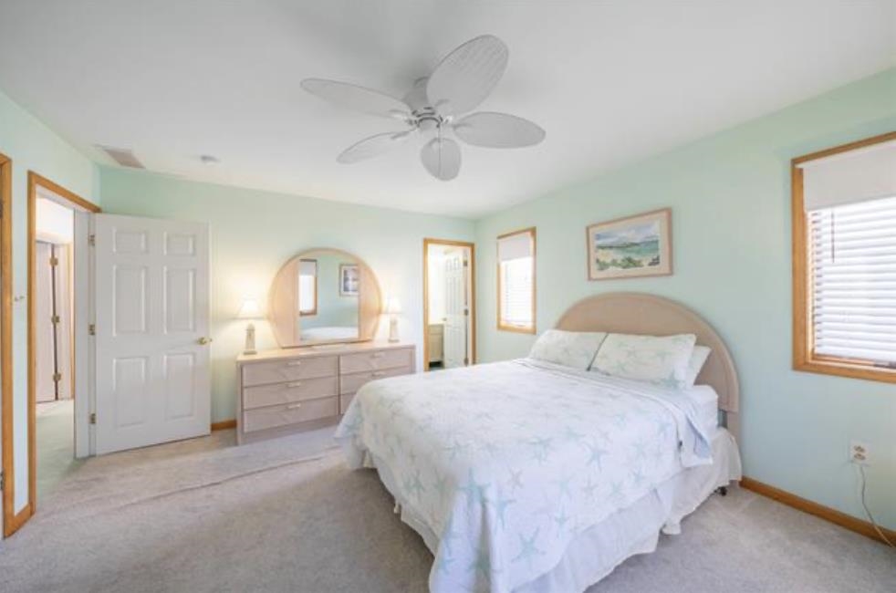 141 8th Street Avalon, NJ 08202 - Photo 10 of 21 a bedroom with a large bed and a window