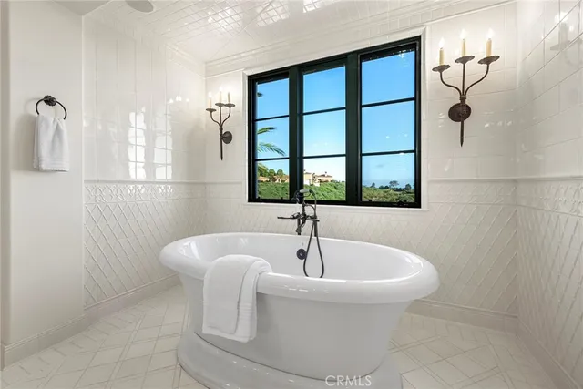 a living room with furniture a ceiling fan and a window