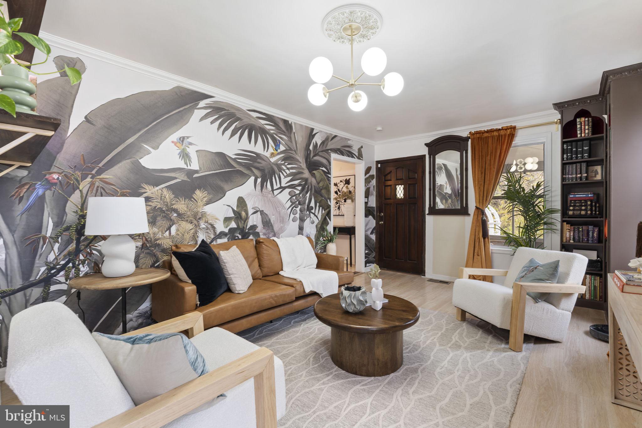 307 Johnson Avenue Upper Chichester, PA 19061 - Photo 10 of 42 a living room with furniture and a chandelier