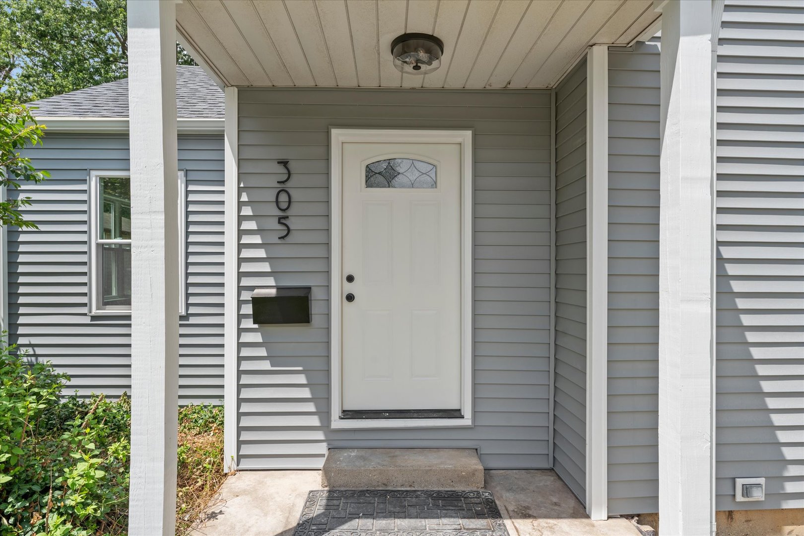 305 South Fair Street Champaign, IL 61821 - Photo 3 of 41 a front view of a house with a door and a window