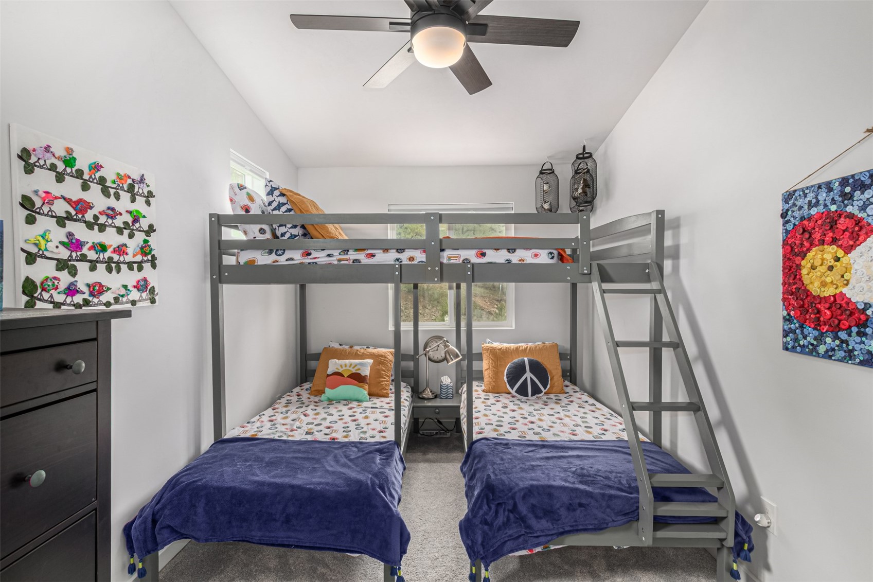 344 Redhill Road Fairplay, CO 80440 - Photo 27 of 44 a bedroom with furniture and a chandelier