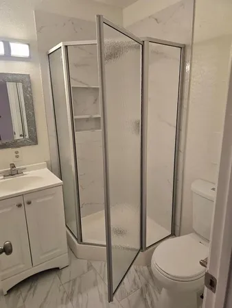 a view of empty room with a fireplace