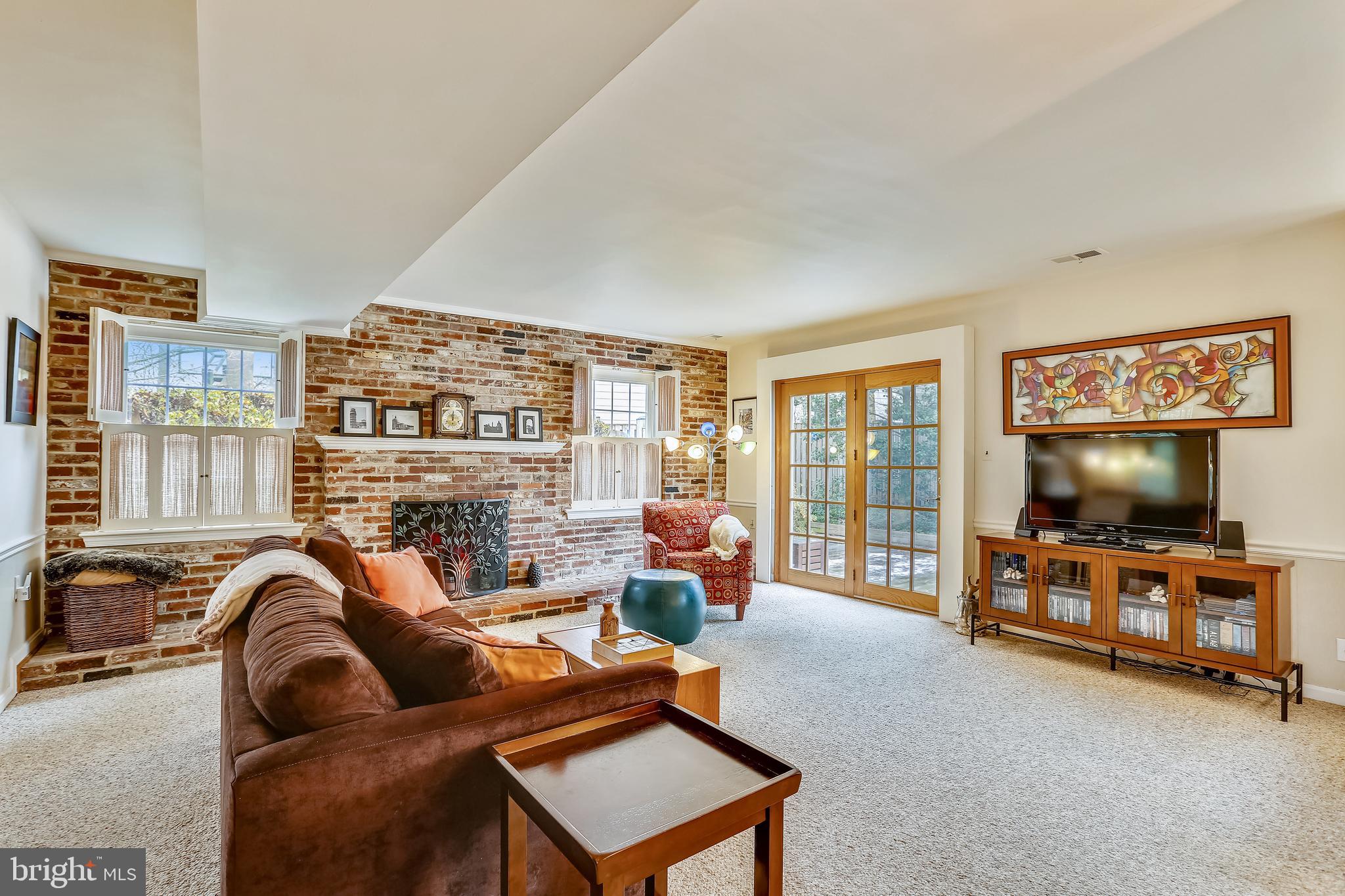 1582 Kimblewick Road Potomac, MD 20854 - Photo 12 of 29 Family room w/ FP, access to deck