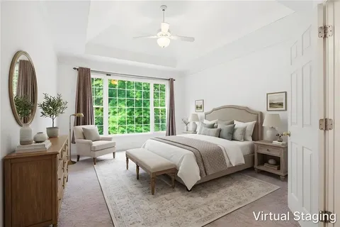 a bed room with a bed and a large window