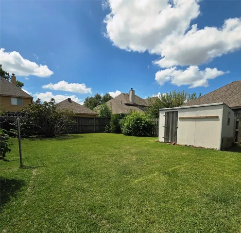 a view of a big yard with a house