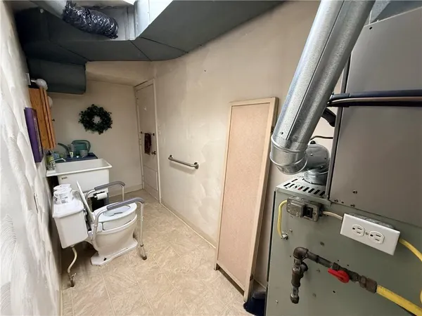 a view of a livingroom with furniture hardwood floor and a flat screen tv
