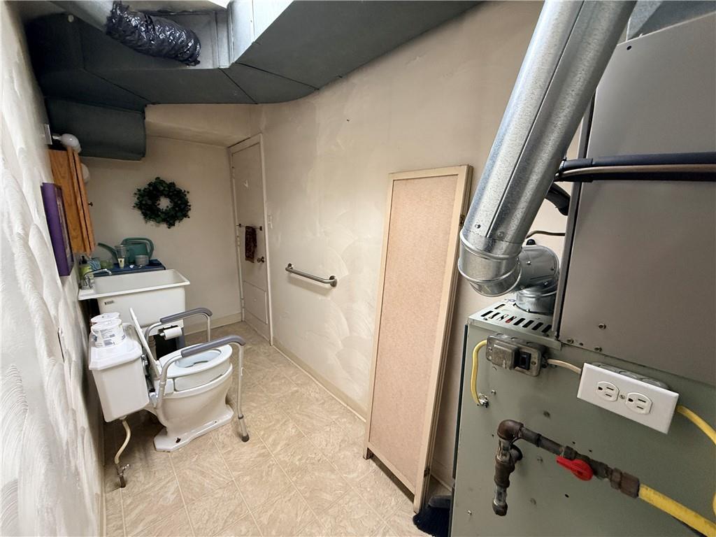 321 Butler Road Kittanning, PA 16201 - Photo 14 of 28 a bathroom with a toilet sink and mirror