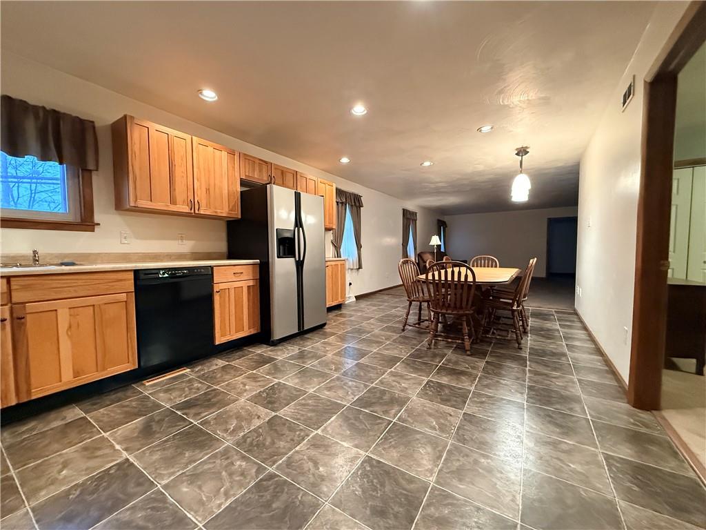 321 Butler Road Kittanning, PA 16201 - Photo 19 of 28 a kitchen with stainless steel appliances granite countertop a sink and a refrigerator