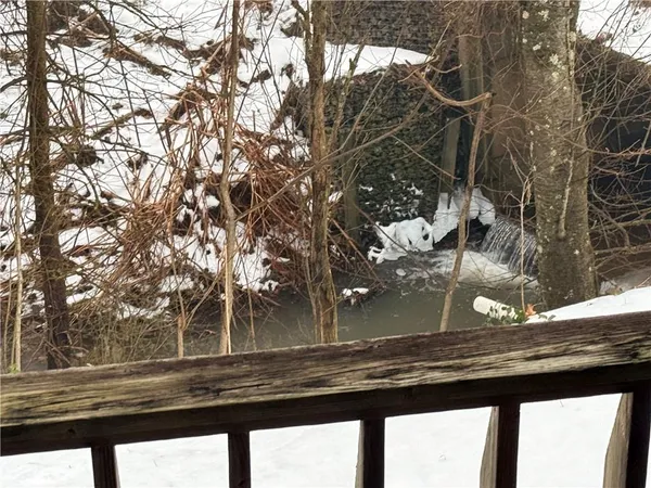 a kitchen with a stove a sink refrigerator and cabinets