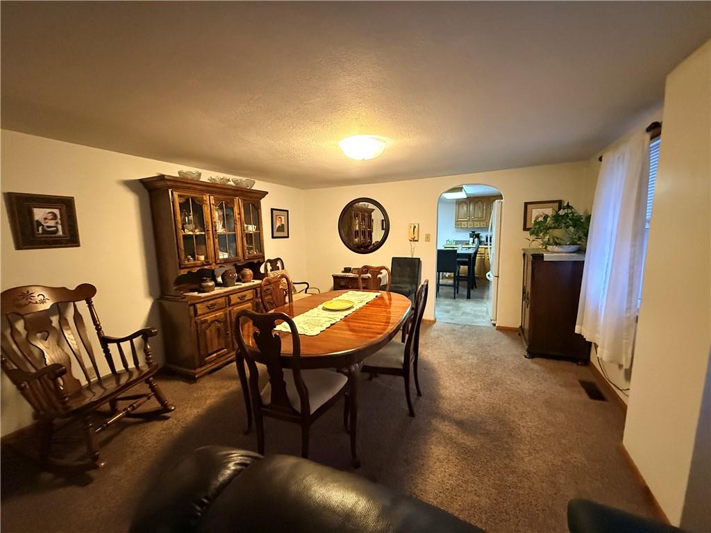 321 Butler Road Kittanning, PA 16201 - Photo 26 of 28 a living room with furniture a flat screen tv and kitchen view