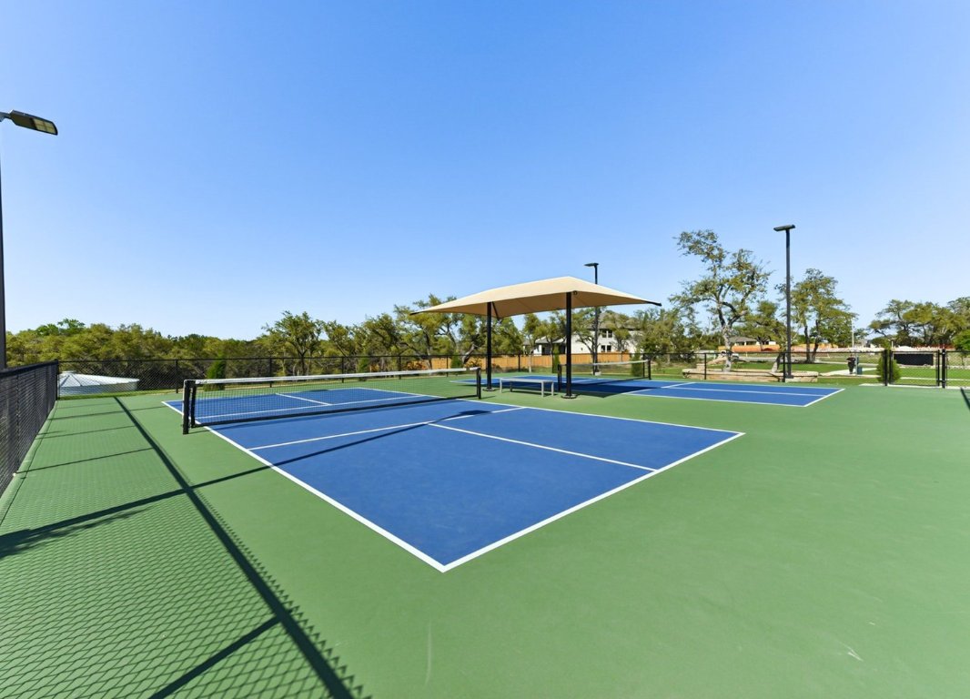 328 Buckaroo Drive Georgetown, TX 78633 - Photo 9 of 9 a view of an outdoor space and tennis court