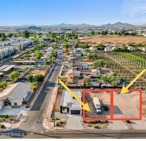 an aerial view of residential houses with outdoor space