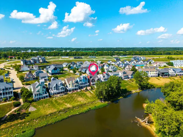 a view of a swimming pool with an outdoor seating and a lake view