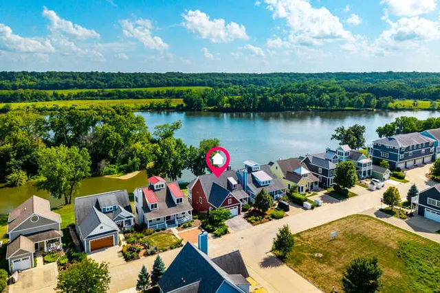 a view of a house with a ocean from a balcony