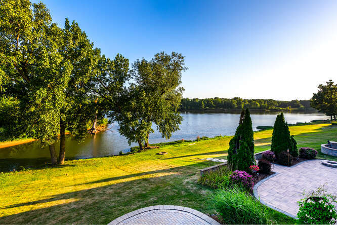9 Windward Way Ottawa, IL 61350 - Photo 16 of 56 a view of a swimming pool with an outdoor seating and a lake view