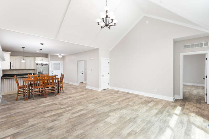 9 Windward Way Ottawa, IL 61350 - Photo 25 of 56 a kitchen with kitchen island a dining table chairs and wooden floor