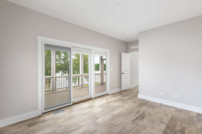 9 Windward Way Ottawa, IL 61350 - Photo 31 of 56 a view of an empty room with wooden floor and a window