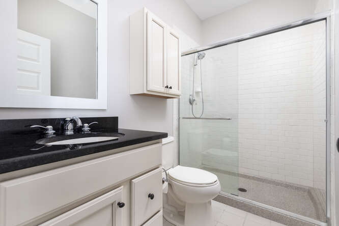 9 Windward Way Ottawa, IL 61350 - Photo 33 of 56 a bathroom with a granite countertop sink toilet and shower