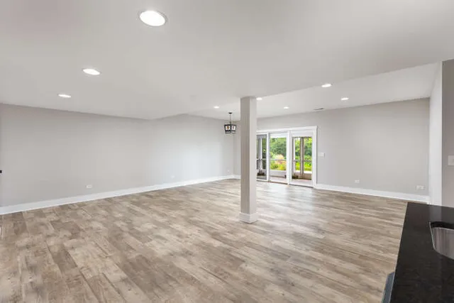 a sign board with yard in the back