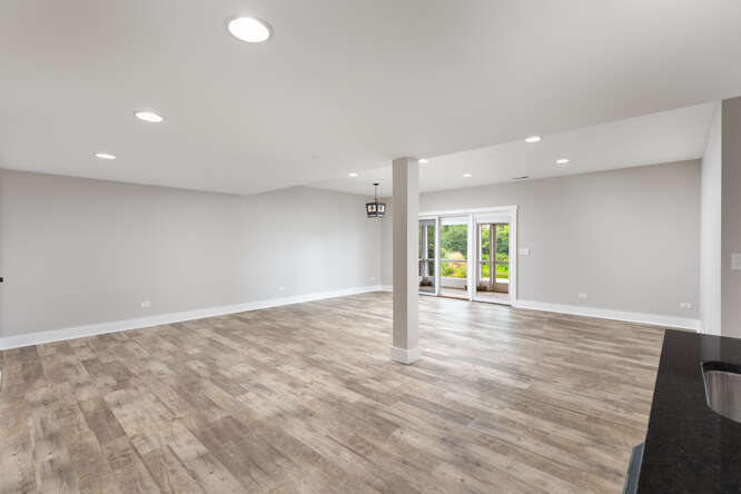 9 Windward Way Ottawa, IL 61350 - Photo 46 of 56 a view of an empty room with wooden floor and a window