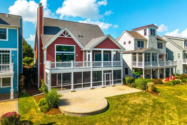 a view of residential houses with swimming pool