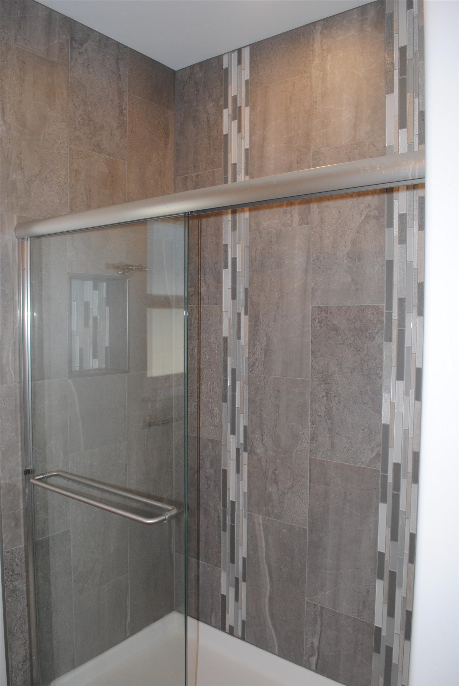 454 Lewis Street Grand Junction, CO 81504 - Photo 6 of 20 a bathroom with a glass shower door