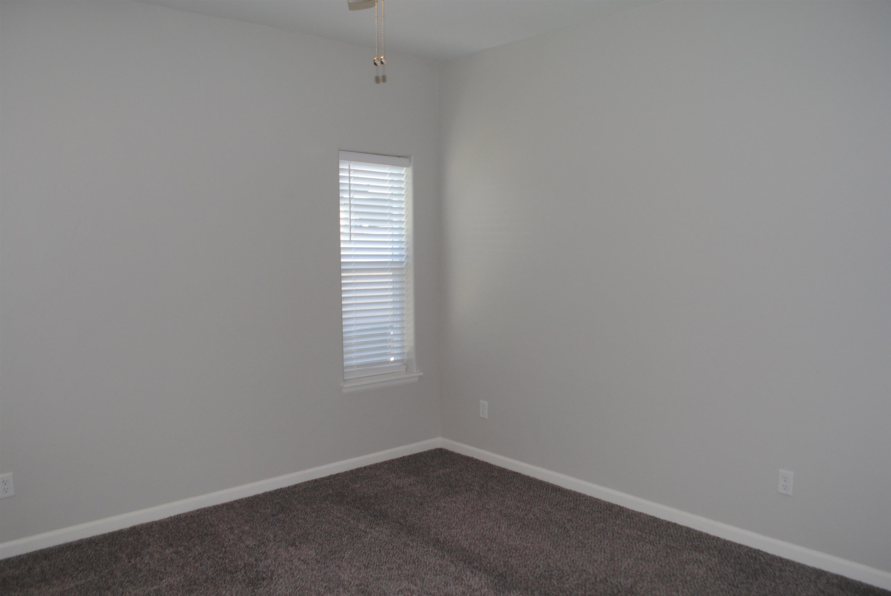 454 Lewis Street Grand Junction, CO 81504 - Photo 8 of 20 a view of an empty room with a window
