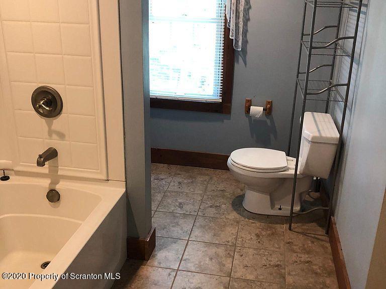 6197 Spring Hill Road Wyalusing, PA 18853 - Photo 11 of 15 a bathroom with a sink and a toilet