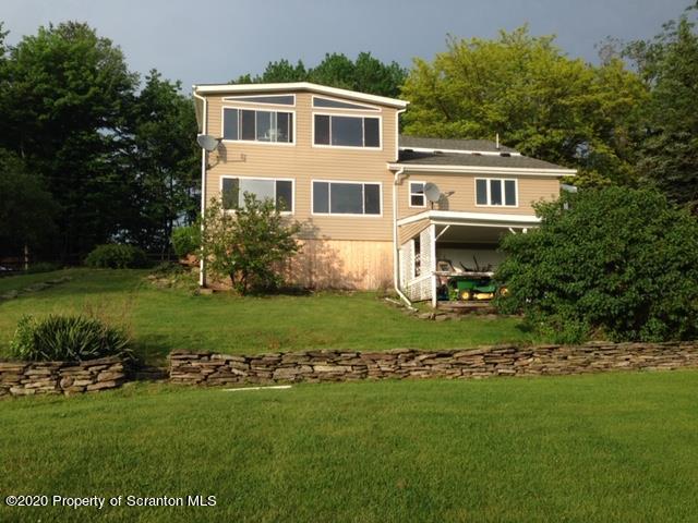 6197 Spring Hill Road Wyalusing, PA 18853 - Photo 5 of 15 a house view with a garden space
