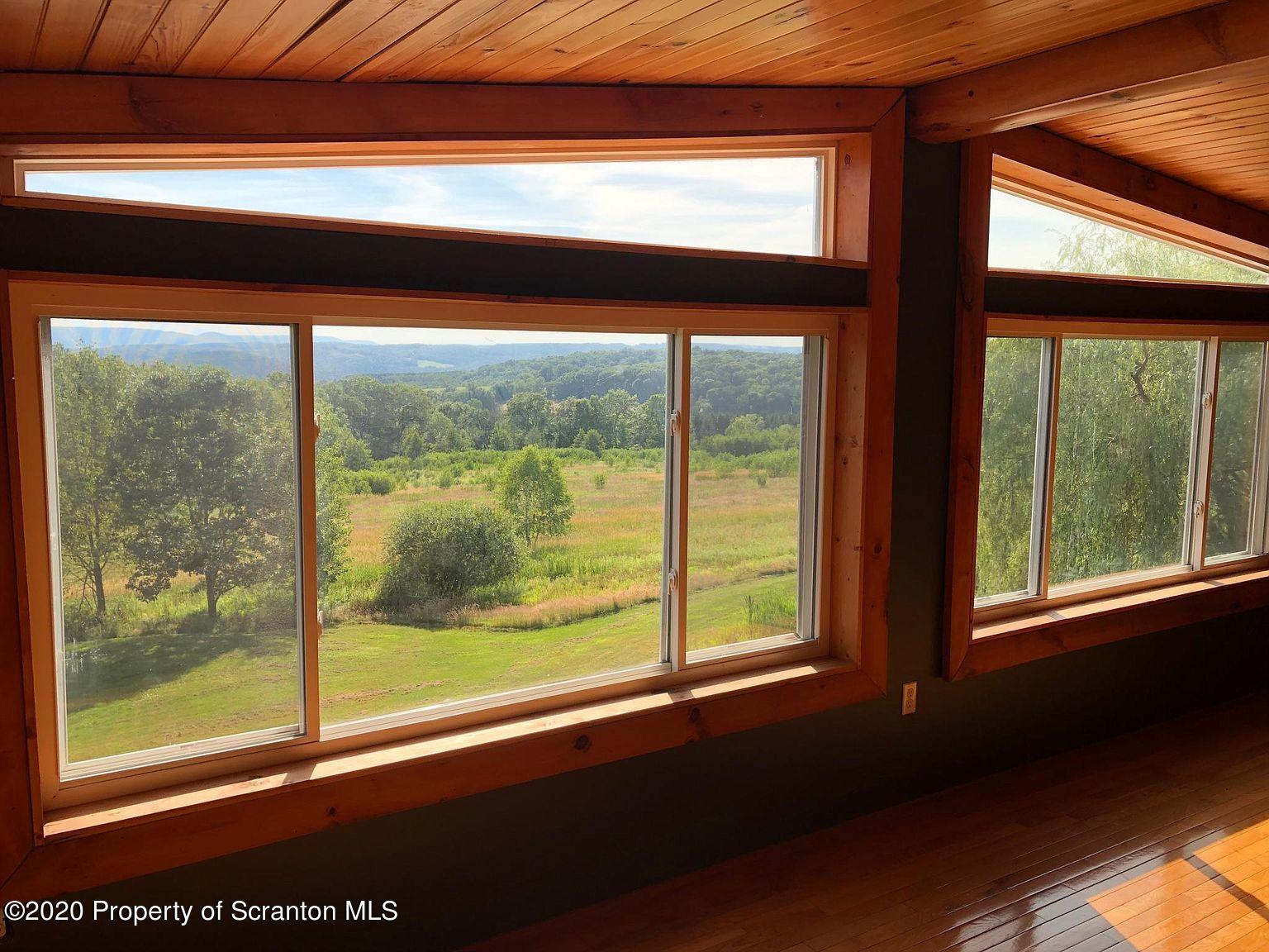 6197 Spring Hill Road Wyalusing, PA 18853 - Photo 8 of 15 a view of a room that has a window