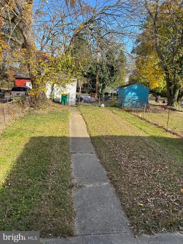 a view of yard with swimming pool