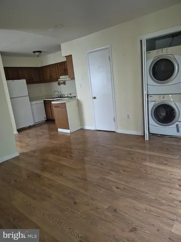 a view of a kitchen with a washer and dryer